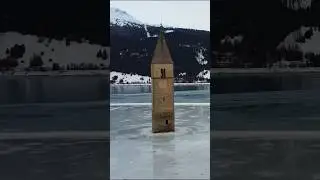 Drone shot - Frozen ❄️ 🥶 Lago Di Resia (Reschensee) and submerged lighthouse, S&uuml;d Tyrol, Italy 🇮🇹