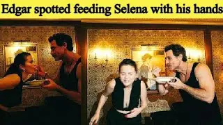 Selena and Edgar feeding each other with their hands
