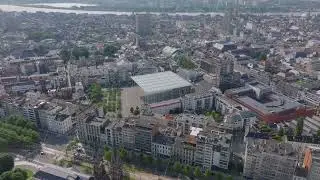 Aerial views of Antwerp highlight the Stadsschouwburg Antwerp theatre, with the scheldt river