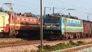 Dynamic Rail Encounter: ASR  Mumbai CSMT Express Crosses Paths with Heavy-loaded BOXON Wagons  WAG7