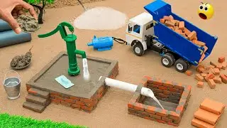 diy mini hand pump surrounded by bricks construction science project @AdgeCreator