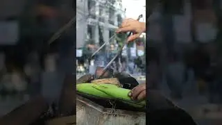 Nepal street food roasted corn in the streets of pokhra lake view