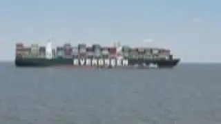Dredging underway to free stuck cargo ship