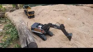 Huina Excavator and Dump Truck on Sand Mound