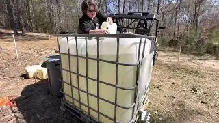 Filling our livestock water tank with water from the creek