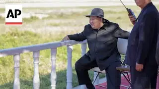 North Korean state media show Kim Jong Un inspecting drone and missile exercises