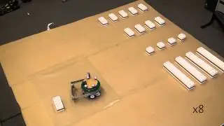 Autonomous Construction of a Roofed Structure: Synthesizing Planning and Stigmergy on a Mobile Robot