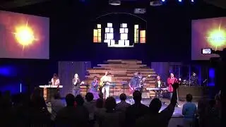 Pastor Mark Clarke leading worship. The song is called God&rsquo;s Grace by Luther Barnes.