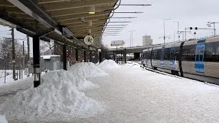 Snow piles on platforms, Gullmarsplan station, Stockholm, for Tvärbanan trams and the metro.