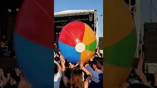 AI Music Festival Beach Ball, someone always brings one