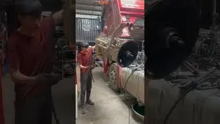 The process of dismantling the engine of a large truck
