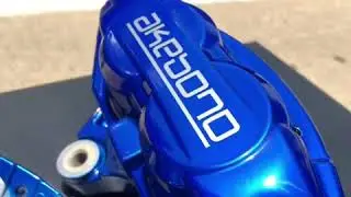 Akebono brake calipers rebuilt and refinished in Peeka Blue Powder Coat in Dallas Texas