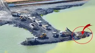 Dozer Shantui in sand Moving Rock Land filling Dump Trucks  By  Wheel Loader Moving Rock to Water