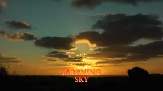 A glorious golden sky. Clouds in rising sun over sea,  English Channel. Time-lapse Isle of Portland