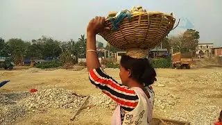Stone scavengers I People collect river stones and sand on the Balason River in Siliguri