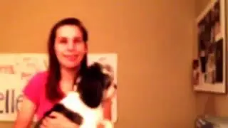 Blind girl dancing with puppy.