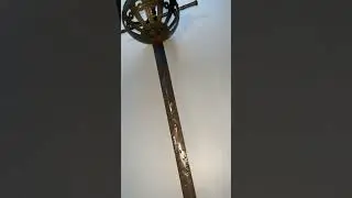 Authentic 18th century sword with decorated metal hilt, reflecting period craftsmanship and elegance