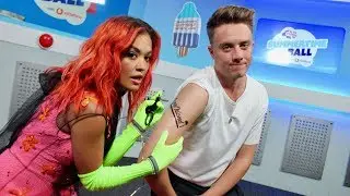 Rita Ora gives Roman Kemp some #CapitalSTB ink