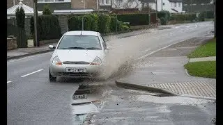 Driver faces &pound;5k fine after splashing mother and children