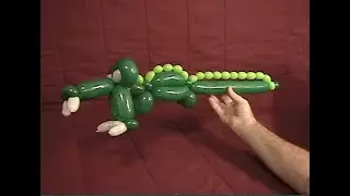 Learn how to make a balloon animal alligator using balloon twisting.