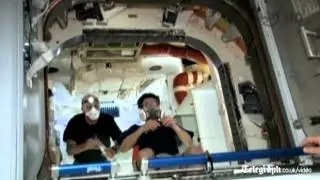 Astronauts float inside SpaceX Dragon capsule