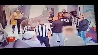 CM Punk chokes Jack Perry backstage at All In London 2023 with narration from Phill Brooks