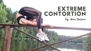 Extreme contortion on the bridge. Contortionist Anya
