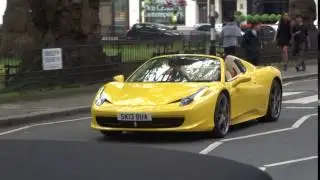 Ferrari 458 Spyder driving through Berkeley Square, London