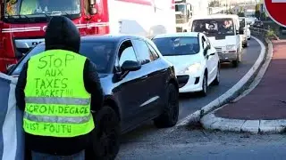 French anti-fuel hike protesters block access to petrol station