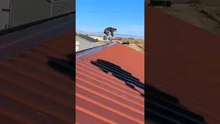 Time lapse of installing ridge cap and screws. #diy #construction #polebarn #postframe #garage