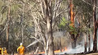Queensland fire crews face another day of challenging conditions