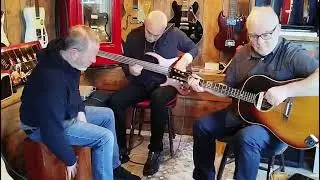 Jim, and Noel Barrett with Trevor Kiely of Crowley's Music Centre