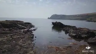 East Prawle Point Arch in rock cliff looks like a Seahorse Devon & Beyond from above DJI Drone