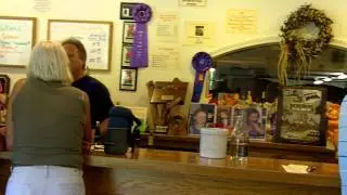 The two winemakers at Oakstone, behind the counter