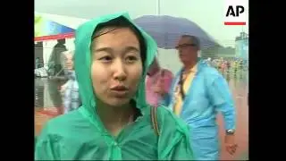 Heavy rain, fans after US beats China in beach volleyball final