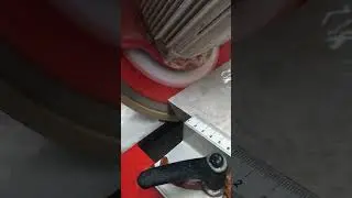 Rubi DW 250 NL 1200 tile saw in action cutting 20mm porcelain at 45 degree mitre
