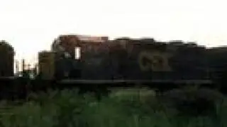 CSX freight with a disassembled Geep at Howell Interlocking