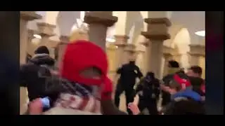 Police clash with rioters inside the US Capitol