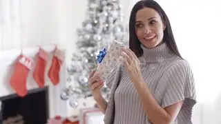 Smiling Young Woman Opening Christmas Present People Stock Footage beauty decoration Envato Elements