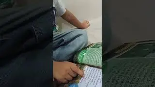 Five-year-old Henry reading an English Cambridge book.