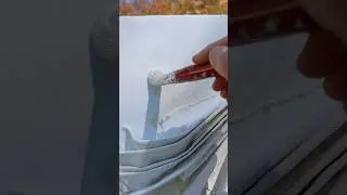 Applying a silky layer of oil paint to a wall sculpture. #outdoors #sculpture #painting #shorts
