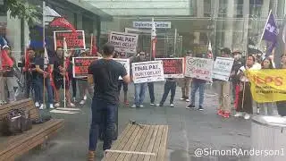 Filipino members of the Migrant Workers Association demonstrate in Queen Street