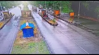 A Chilling clip of a truck losing control smashes in toll booth
