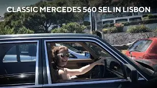 Classic Mercedes 560 SEL W126 driving in Lisbon Portugal