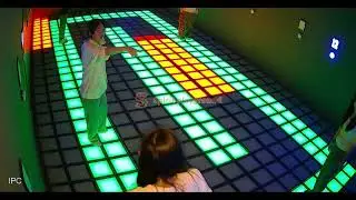 kids active floor tiles in community playground, toddler active game