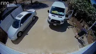 Amazon delivery driver chucks packages over fence and gate