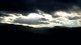 Sun Behind Clouds. Time Lapse Sun rays