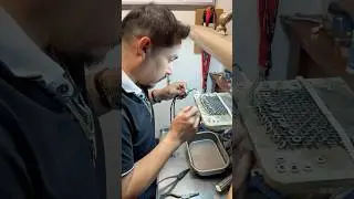 Crafting a handmade silver Cuban chain.