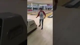 Little girl tries to bowl and loses her ball.