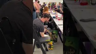 Inspiring live art event where artist create new work in front of a crowd of people.